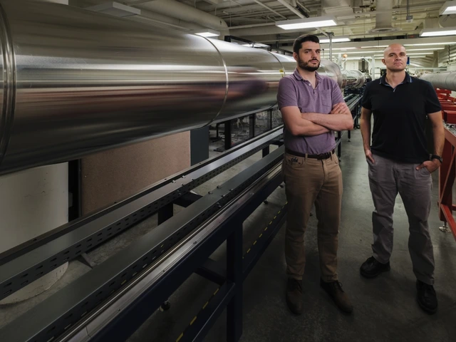 Alex Craig (left), assistant professor of aerospace and mechanical engineering, and associate professor Jesse Little with the 15-inch-diameter Mach 5 Ludwieg tube in the UArizona College of Engineering's Boundary-Layer Stability and Transition Laboratory. New state and federal funding totaling $10 million will support a suite of upgrades for the university's hypersonics facilities.